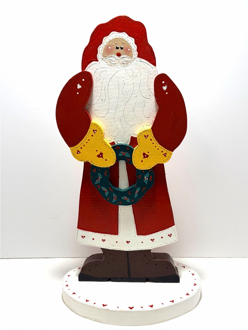Vintage Hand Painted Wooden Santa Figurine with Green Wreath and Yellow Mittens